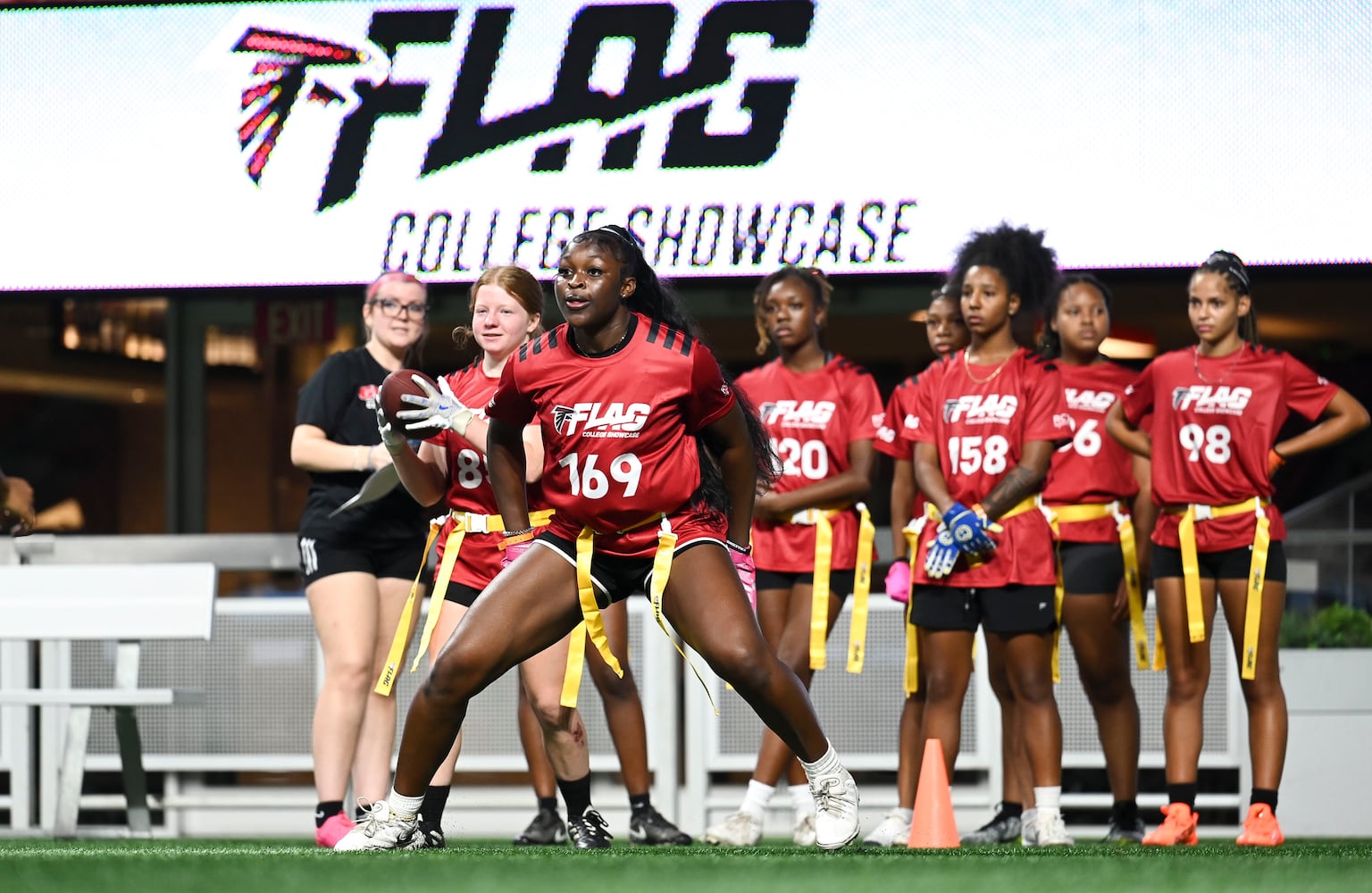 Binta Darbo (front) runs drills during the 5th annual Girls Flag Football Showcase hosed by the Atlanta Falcons Monday, Aug. 25, 2025 at the Mercedes-Benz Stadium. (Daniel Varnado for the AJC)