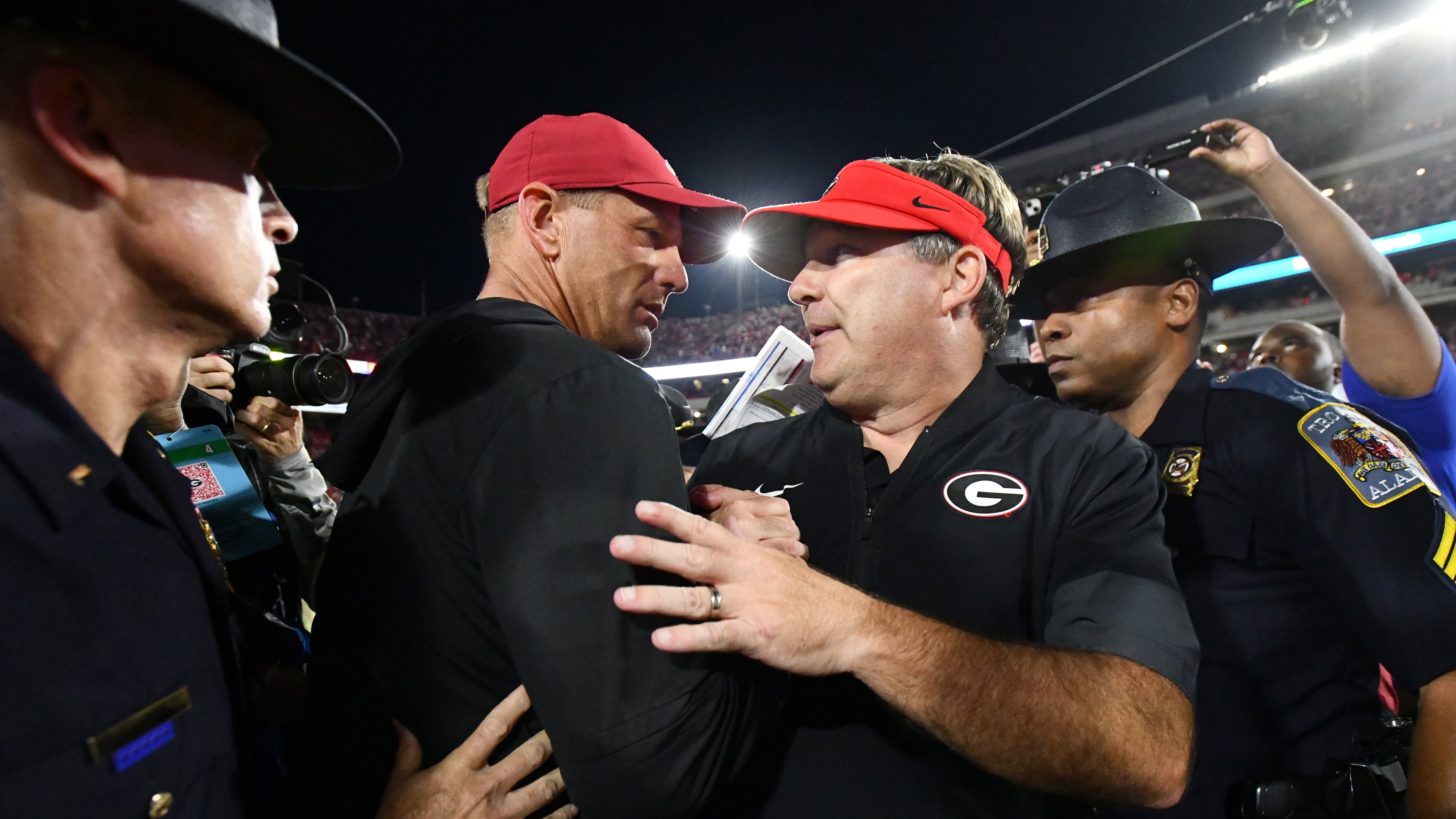 Georgia head coach Kirby Smart (right) and Alabama head coach Kalen DeBoer shake hands after Alabama beat Georgia in an NCAA football game at Sanford Stadium, Saturday, September 27, 2025, in Athens. Alabama won 24-21 over Georgia. (Hyosub Shin / AJC)