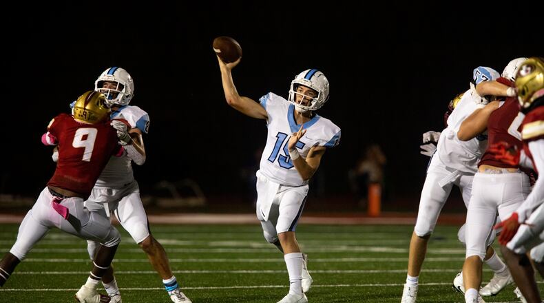 Cambridge quarterback Zach Harris (15) throws the ball during a GHSA high school football game between Cambridge High School and Johns Creek High School in Johns Creek, Ga. on Friday, October 15, 2021. (Photo/Jenn Finch)