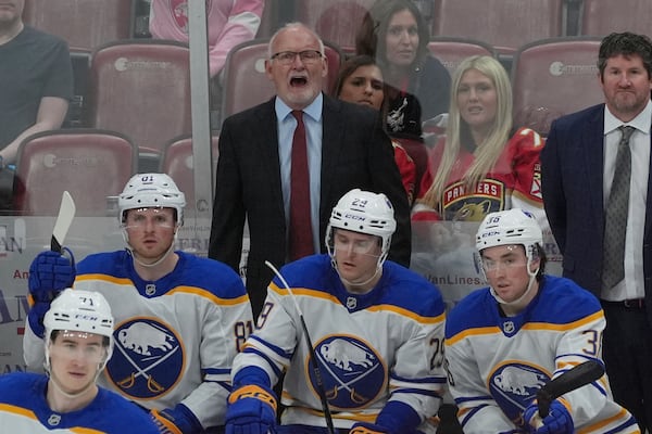 Buffalo Sabres head coach Lindy Ruff gestures during the second period of an NHL hockey game against the Florida Panthers, Saturday, April 12, 2025, in Sunrise, Fla. (AP Photo/Marta Lavandier)