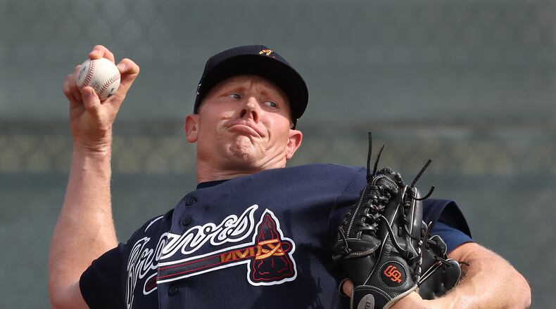 Braves pitcher Mark Melancon delivers a pitch working from the mound during spring training on Friday, Feb. 14, 2020, in North Port. Curtis Compton ccompton@ajc.com