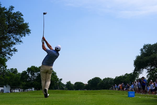 Scottie Scheffler tees off on the 13th hole during the first round of the Charles Schwab Challenge golf tournament at Colonial Country Club in Fort Worth, Texas, Thursday, May 22, 2025. (AP Photo/LM Otero)