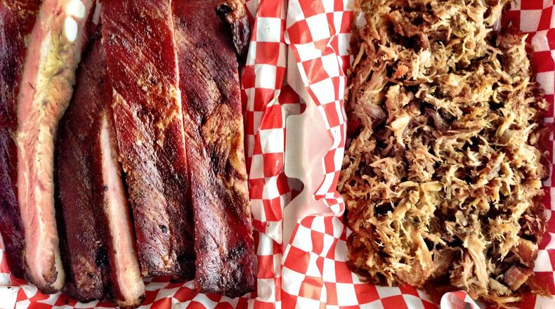 Pitmaster Bryan Fuhrman smokes pork ribs and pasture-raised whole hogs at B’s Cracklin’ BBQ. CONTRIBUTED BY WYATT WILLIAMS