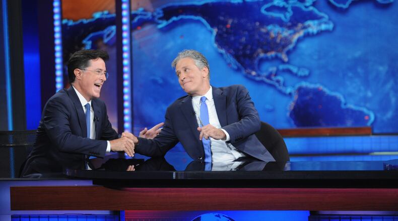 NEW YORK, NY - AUGUST 06: Stephen Colbert and Jon Stewart appear on "The Daily Show with Jon Stewart" #JonVoyage on August 6, 2015 in New York City. (Photo by Brad Barket/Getty Images for Comedy Central)