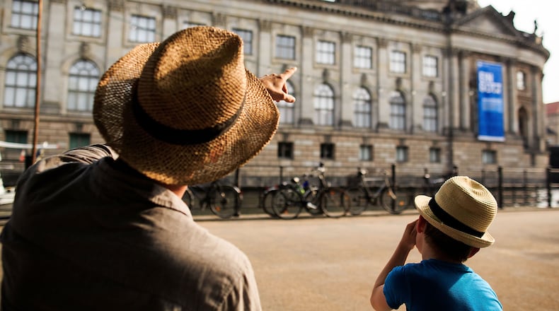 BERLIN, GERMANY - JULY 04: A father and his son look to the Bode Museum along the Spree River during a sweltering summer day on July 4, 2015 in Berlin, Germany. (Photo by Carsten Koall/Getty Images)