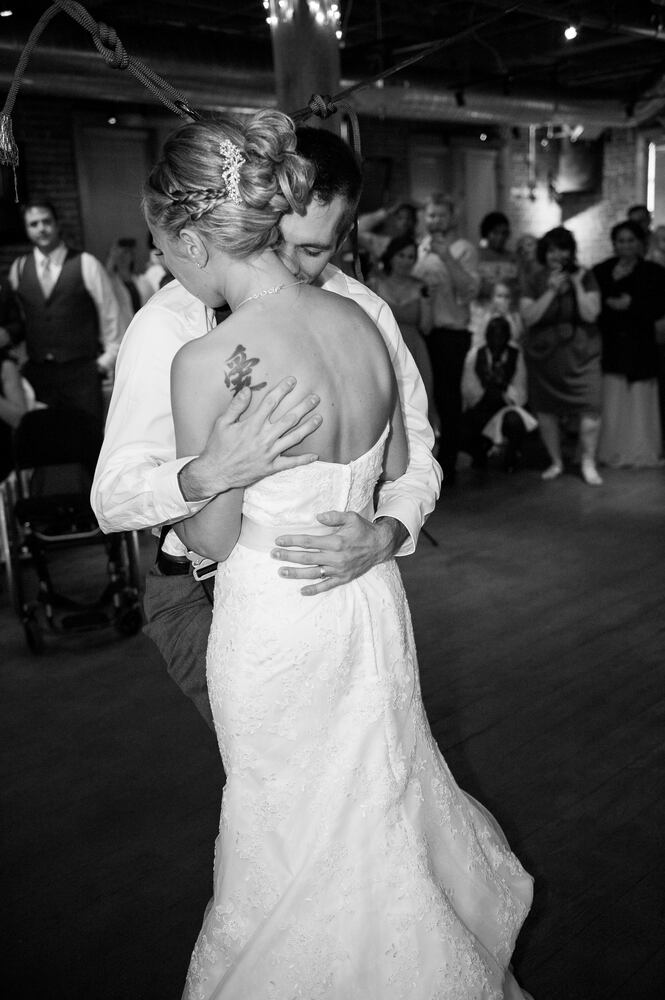 Paraplegic veteran surprises bride by standing for first dance