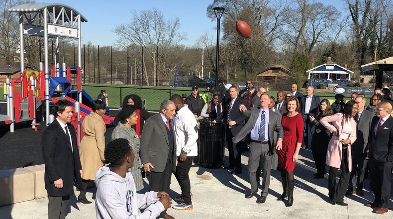 NFL Commissioner Roger Goodell tosses a football to a Tyriq Dabney, a student at Hollis Innovation Academy in the Vine City neighborhood near Mercedes-Benz Stadium on Thursday, Jan. 31, 2019. Goodell, Atlanta Falcons owner Arthur Blank and Mayor Keisha Lance Bottoms helped commemorate the re-opening of John F. Kennedy Park, which underwent a five-month renovation as part of a gift from the NFL Foundation and the Atlanta Super Bowl Host Committee. J. SCOTT TRUBEY/STRUBEY@AJC.com
