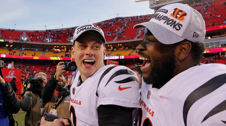 Quarterback Joe Burrow (9) of the Cincinnati Bengals and defensive tackle Tyler Shelvin (99) celebrate following the Bengals overtime win against the Kansas City Chiefs in the AFC Championship Game at Arrowhead Stadium on January 30, 2022, in Kansas City, Missouri. (David Eulitt/Getty Images/TNS)