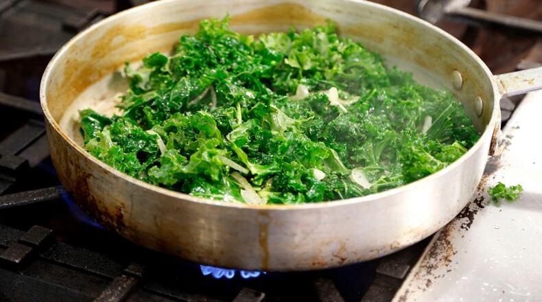 Chef Bob Perry cooks curly kale in a food lab kitchen at the University of Kentucky on Jan. 7, 2016 in Lexington, Ky. (Charles Bertram/Lexington Herald-Leader/TNS)