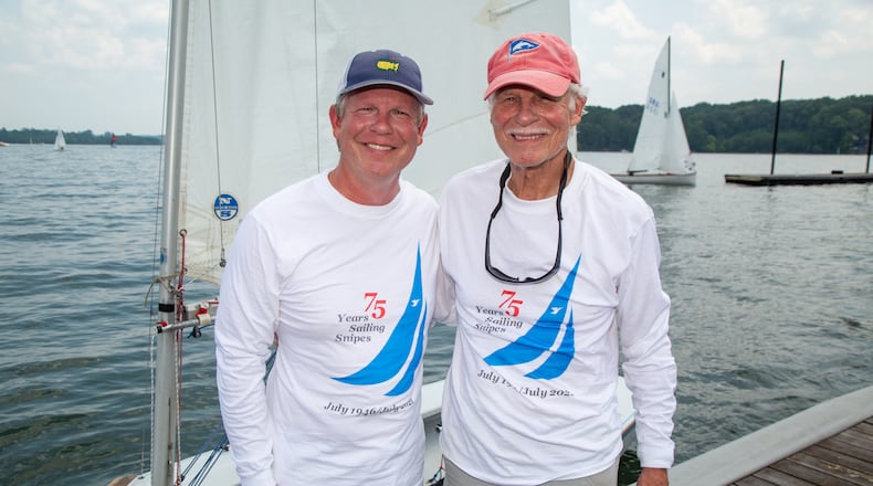 John Muhlhausen (right) and his son David near his Snipe sailboat at the the Atlanta Yacht Club on Lake Allatoona. At age 81, John is celebrating 75 years of sailing and has been a member of the sailing club for 52 years.  PHIL SKINNER FOR THE ATLANTA JOURNAL-CONSTITUTION.