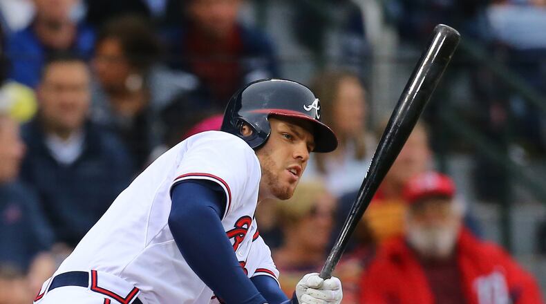 The Braves’ Freddie Freeman rips a single against the Nationals during the first inning of a baseball game on Monday, April 27, 2015, at Turner Field. (Curtis Compton / ccompton@ajc.com)