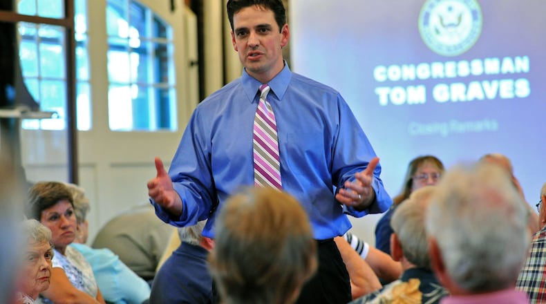110809 Dalton : Rep. Tom Graves (center) speaks during a town hall meeting at Dalton Freight Depot in Dalton on Tuesday, August 9, 2011. Rep. Tom Graves (R-GA-09) hosts a series of town hall meetings across the 9th Congressional District during the month of August. Hyosub Shin, hshin@ajc.com Rep. Tom Graves speaks in Dalton in 2011 (AJC file/Hyosub Shin)