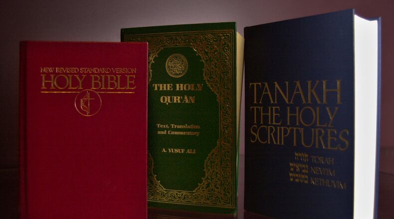 011115 - DECATUR, GA -- The Holy Bible (left), the Holy Qur'an (center) and Tanakh the Holy Scriptures. Books are Courtesy of Pitts Theology Library of Emory University. File photos