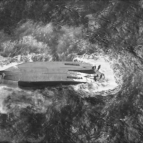 A U.S. Coast Guard HC-130 Hercules airplane crew assigned to Coast Guard Air Station Barbers Point flies over an overturned vessel offshore Saipan, Saturday, April 18, 2026, while searching for a missing vessel, the Mariana, that experienced an engine failure April 15. (U.S. Coast Guard/Air Station Barbers Point via AP)