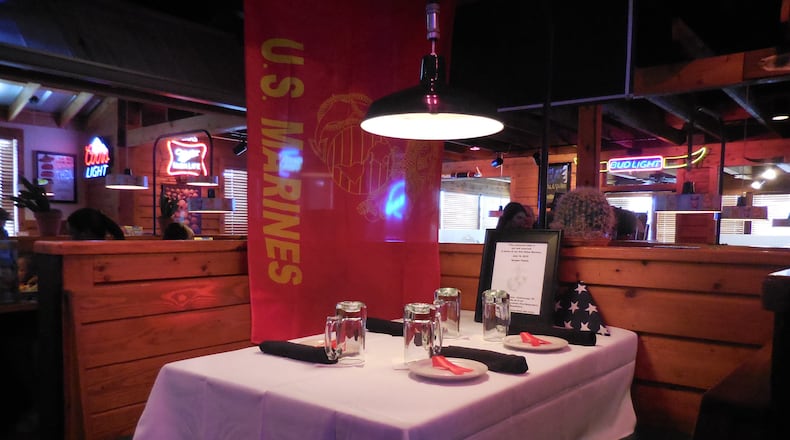 This table at the Texas Roadhhouse restaurant in Chattahooga has been set in honor of the slain servicemen. Photo: Jennifer Brett