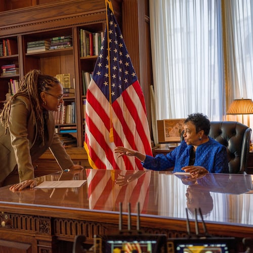 This image released by Netflix shows director Ava DuVernay, left, with 14th librarian of Congress, Carla Hayden, during the filming of the documentary “14th" about the 14th amendment, which gave liberty and rights to formerly enslaved people following the Civil War. (Paul Garnes/Netflix via AP)