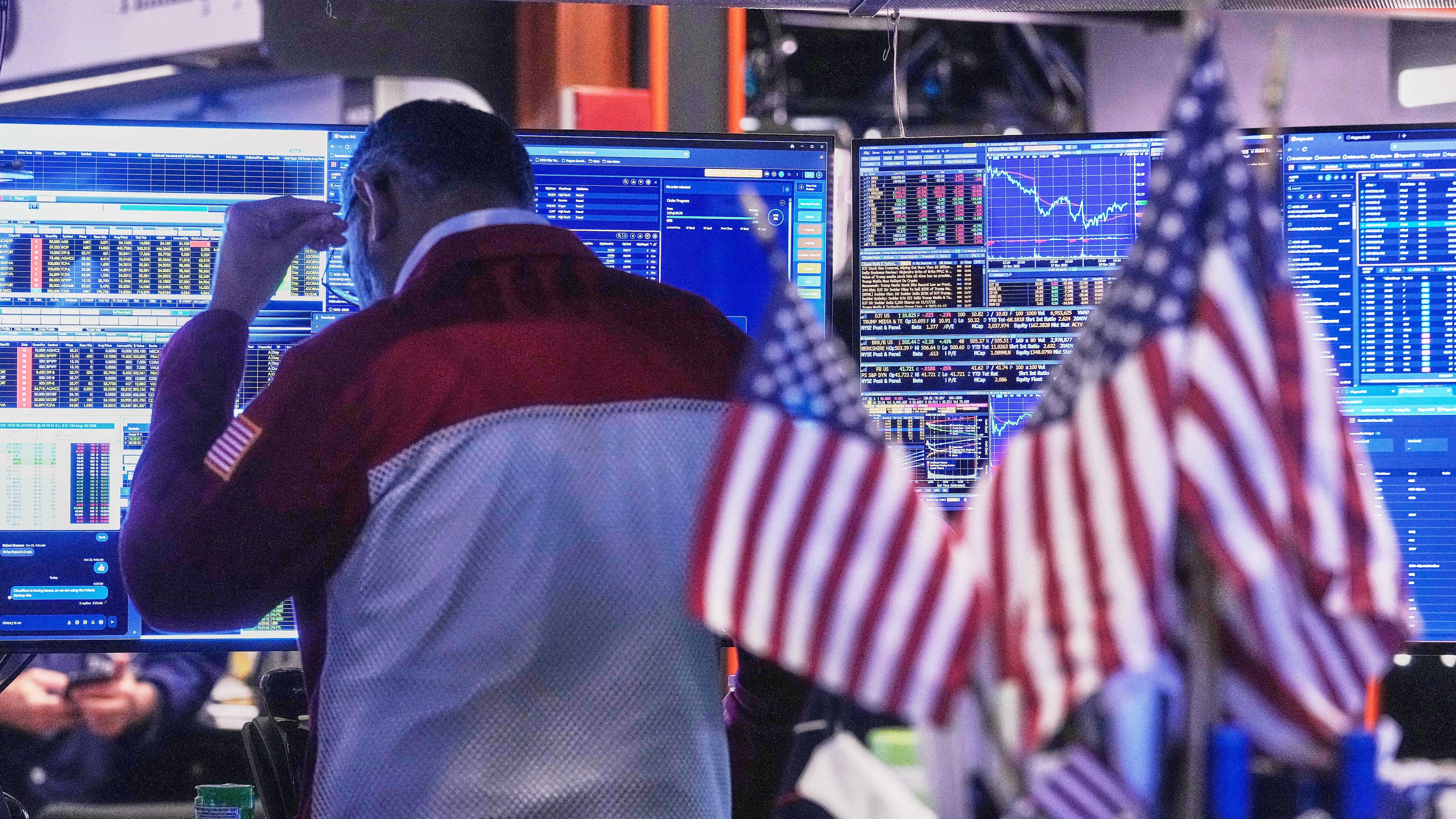 Trader Anan Patel works on the floor of the New York Stock Exchange, Tuesday, Nov. 18, 2025. (AP Photo/Richard Drew)