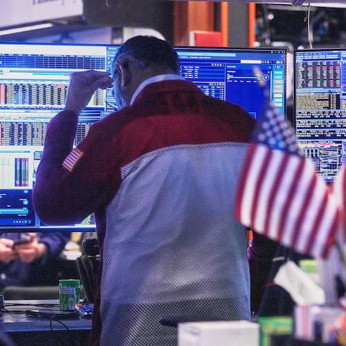 Trader Anan Patel works on the floor of the New York Stock Exchange, Tuesday, Nov. 18, 2025. (AP Photo/Richard Drew)