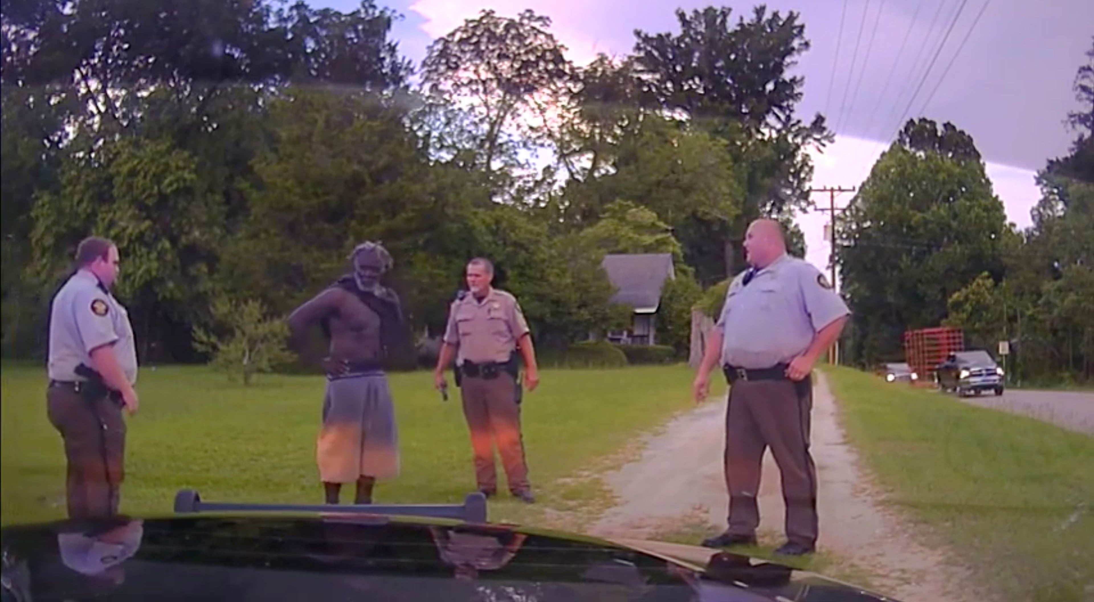Washington County Deputies Rhett Scott (from left), Henry Copeland and Michael Howell stop Eurie Martin while he walks to his sister's house on July 7, 2017. Moments later, Martin is shocked with a Taser, as seen in this video obtained from the Washington County Superior Court by Georgia Public Broadcasting News. (Courtesy Georgia Public Broadcasting)