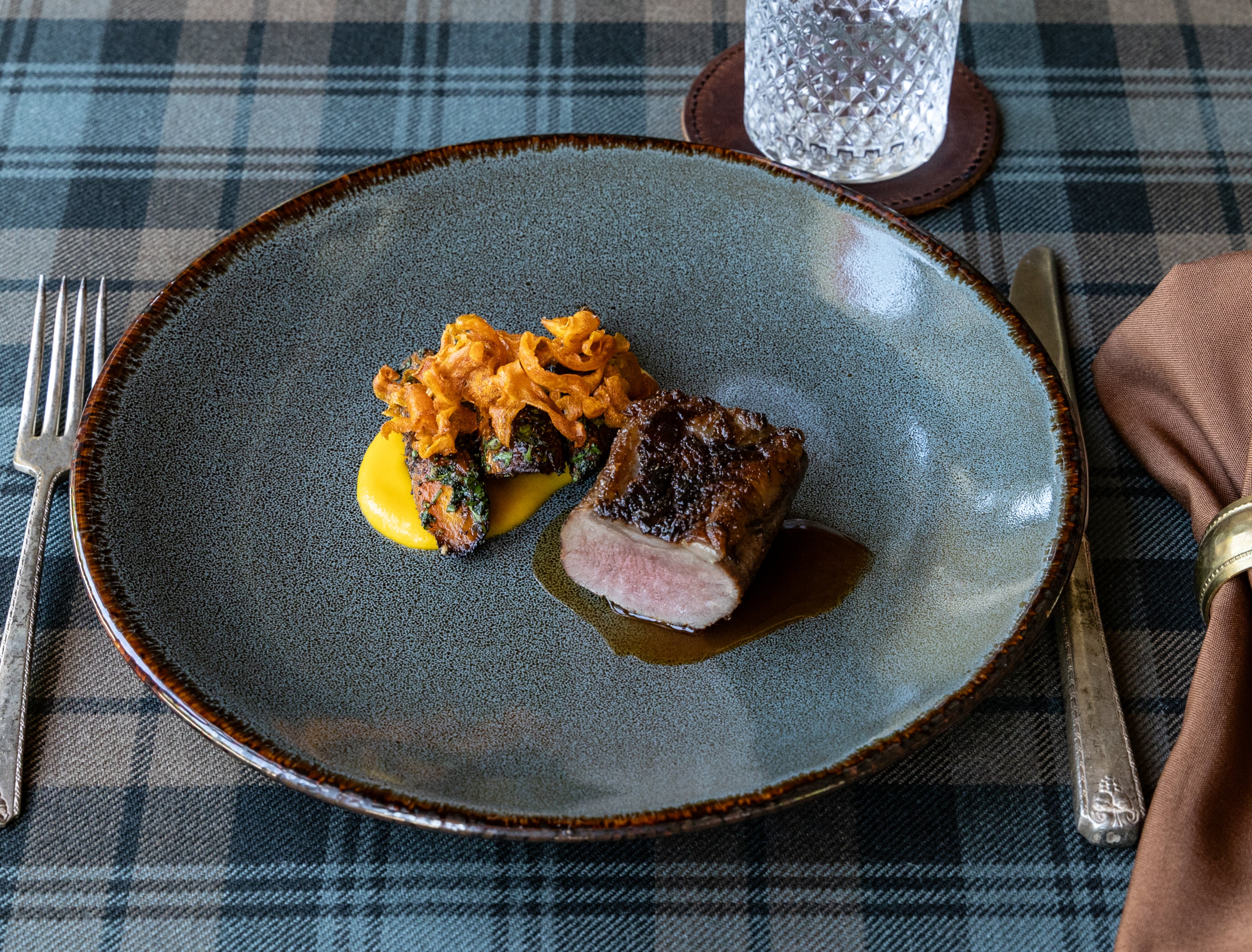 Roasted lamb loin has been on the menu at Nàdair, Kevin Gillespie's Scottish fine dining restaurant. (Angie Mosier)