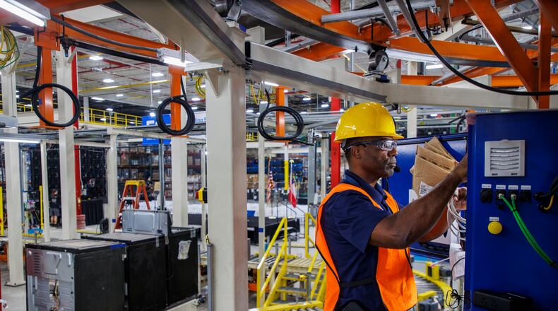 Technician Jerry Talley works on the new APEX manufacturing line at the Roper Corp. facility in LaFayette. The plant makes ovens, ranges and cook tops.