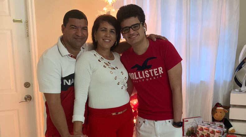 This undated photo provided by the family of Yoel Rodriguez Naranjo via Morgan & Morgan on Wednesday, Sept. 9, 2026, shows Naranjo, left, with his wife and son. (Family/Morgan & Morgan via AP)