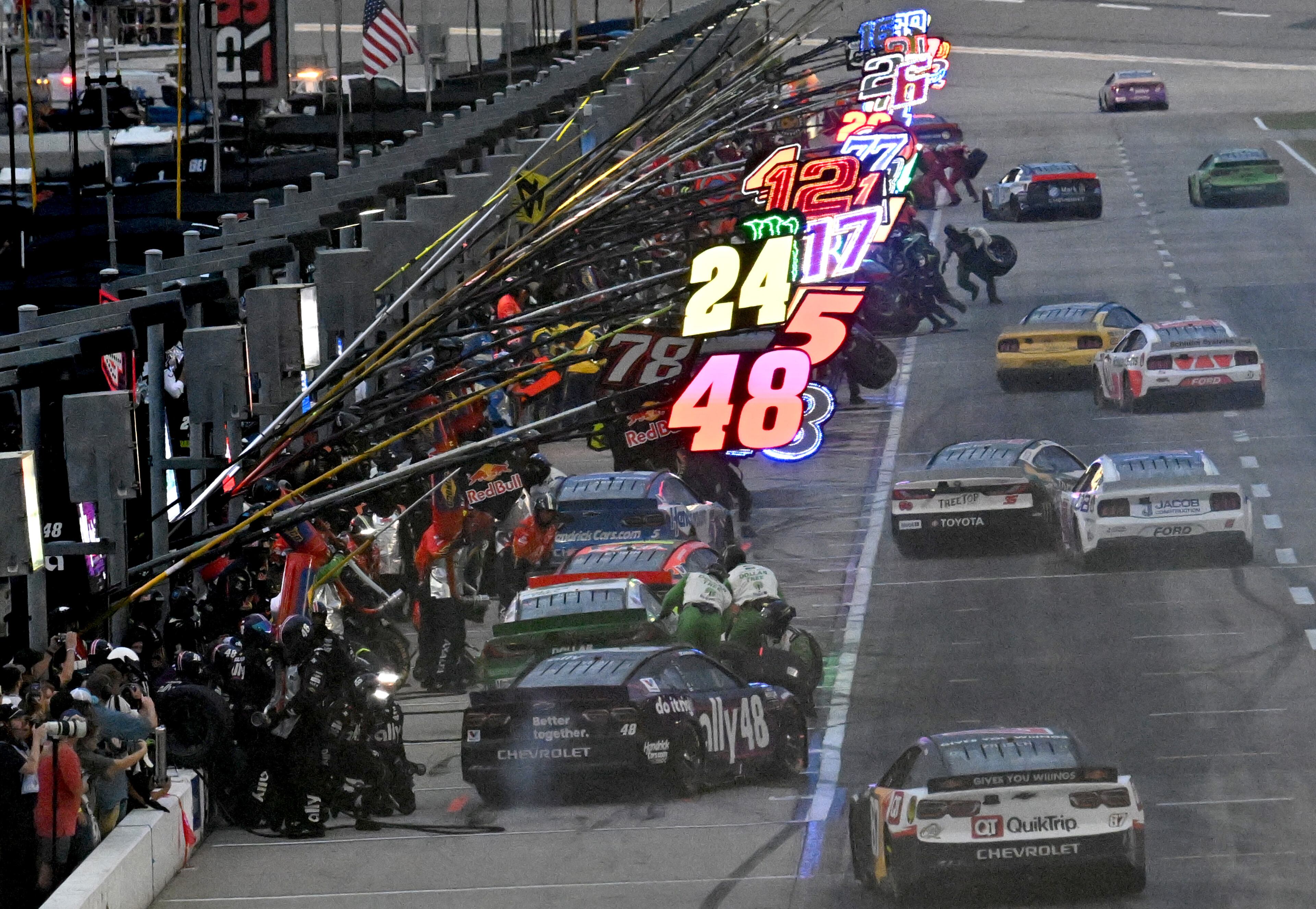 The cars line up in the pits during Quaker State 400 NASCAR Cup Series race at EchoPark Speedway, Saturday, June 28, 2025, in Hampton. (Hyosub Shin / AJC)