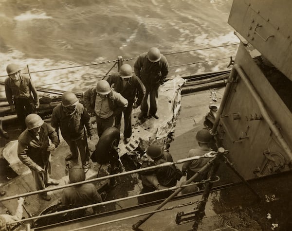 This image provided by the U.S. National Archives shows shows the remains of a Japanese Zero fighter plane that hit the USS Missouri off Okinawa Japan on April 11, 1945. (U.S. National Archives photo no. 80-G-273955 via AP)