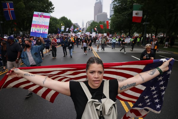 Demonstrators march down Benjamin Franklin Parkway during the "No Kings" protest, Saturday, June 14, 2025, in Philadelphia. (AP Photo/Yuki Iwamura)