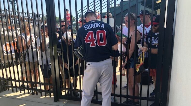 The Braves’ Mike Soroka signed autographs after pitching against the Pirates in Bradenton, Fla., on Wednesday.