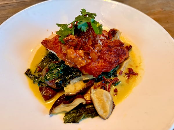 Grouper with Coconut Collard Greens from Miller Union. (Angela Hansberger for The Atlanta Journal-Constitution)