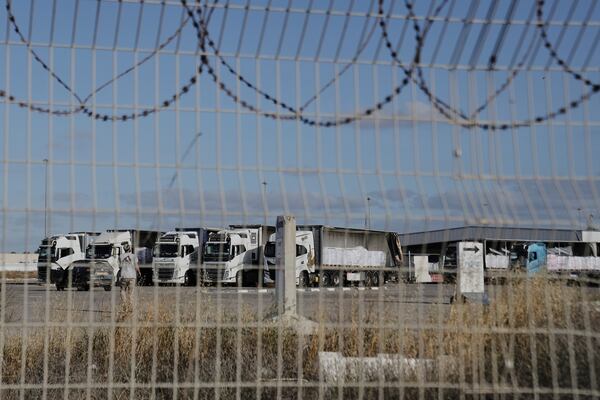 Trucks load with humanitarian aid for the Gaza Strip are seen at the Kerem Shalom Crossing in southern Israel, Tuesday May 20, 2025. (AP Photo/Maya Alleruzzo)