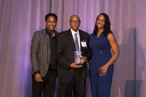 Tony Light (center) receives a Hall of Fame induction at the Atlanta Press Club on Oct. 28, 2024 at the Intercontinental Hotel in Buckhead with presenter Tom Jones (left) and host Blayne Alexander (right). KRYS ALEX