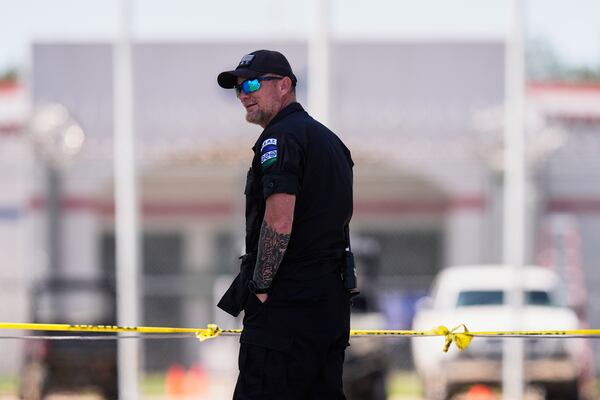 Security personnel stand guard outside the Central Louisiana Ice Processing Center in Jena, La., during an immigration hearing for Mahmoud Khalil, the Columbia University activist facing deportation for his role in pro-Palestinian campus protests, Friday, April 11, 2025. (AP Photo/Gerald Herbert)
