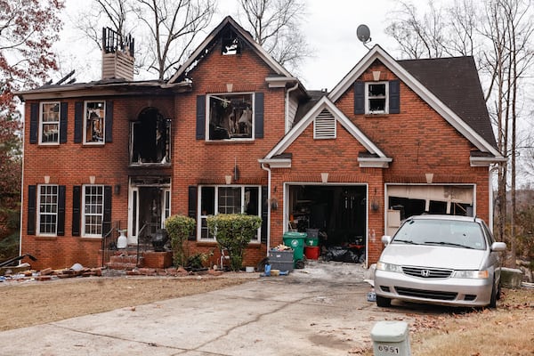 The home in Stone Mountain is unlivable after a fire Monday. (Natrice Miller/AJC)