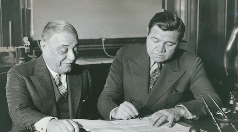 Babe Ruth, right, of the New York Yankees, signs his 1934 contract with Jacob Ruppert, who owned the team, in New York on Jan. 14, 1934. Under Ruppert's ownership, the Yankees won seven World Series, and he oversaw the addition of Ruth and Lou Gehrig to the team. (The New York Times)