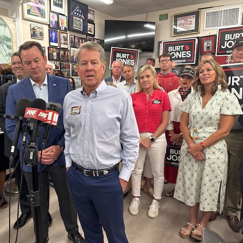 Gov. Brian Kemp (right) campaigns with Lt. Gov. Burt Jones shortly after endorsing him in the Republican primary for governor. (Greg Bluestein/AJC)
