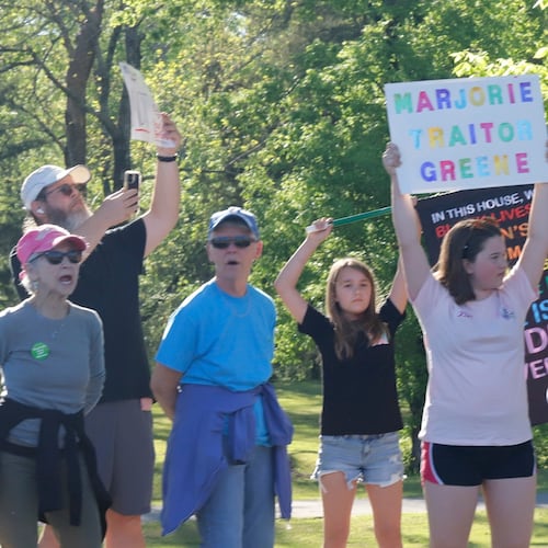 Protesters rallied in Acworth earlier this year outside of the town hall being held by Marjorie Taylor Greene, who announced last month that she is resigning from Congress. (Jenni Girtman for the AJC)