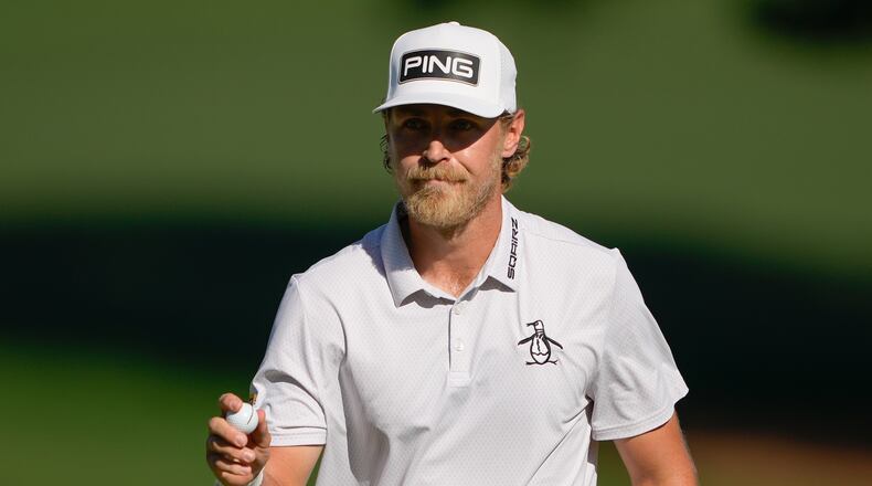 Kristoffer Reitan, of Norway, waves after a birdie on the 15th hole during the final round of the Truist Championship golf tournament at the Quail Hollow Club, Sunday, May 10, 2026, in Charlotte, N.C. (AP Photo/Chris Carlson)