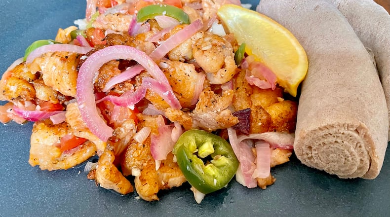 The fish tibs at Desta are a hybrid of a stir fry and a stew. This one was made with grouper. Angela Hansberger for The Atlanta Journal-Constitution
