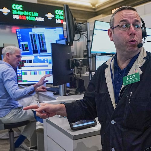 Options trader Matthew Hefter, center, works on the floor of the New York Stock Exchange, Thursday, April 23, 2026. (AP Photo/Richard Drew)