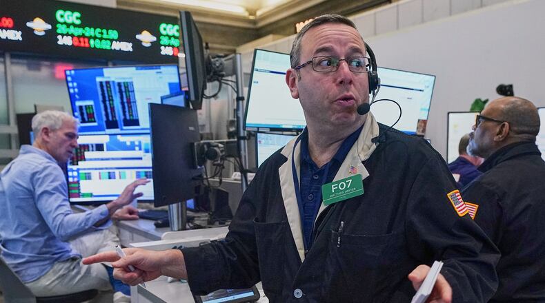 Options trader Matthew Hefter, center, works on the floor of the New York Stock Exchange, Thursday, April 23, 2026. (AP Photo/Richard Drew)