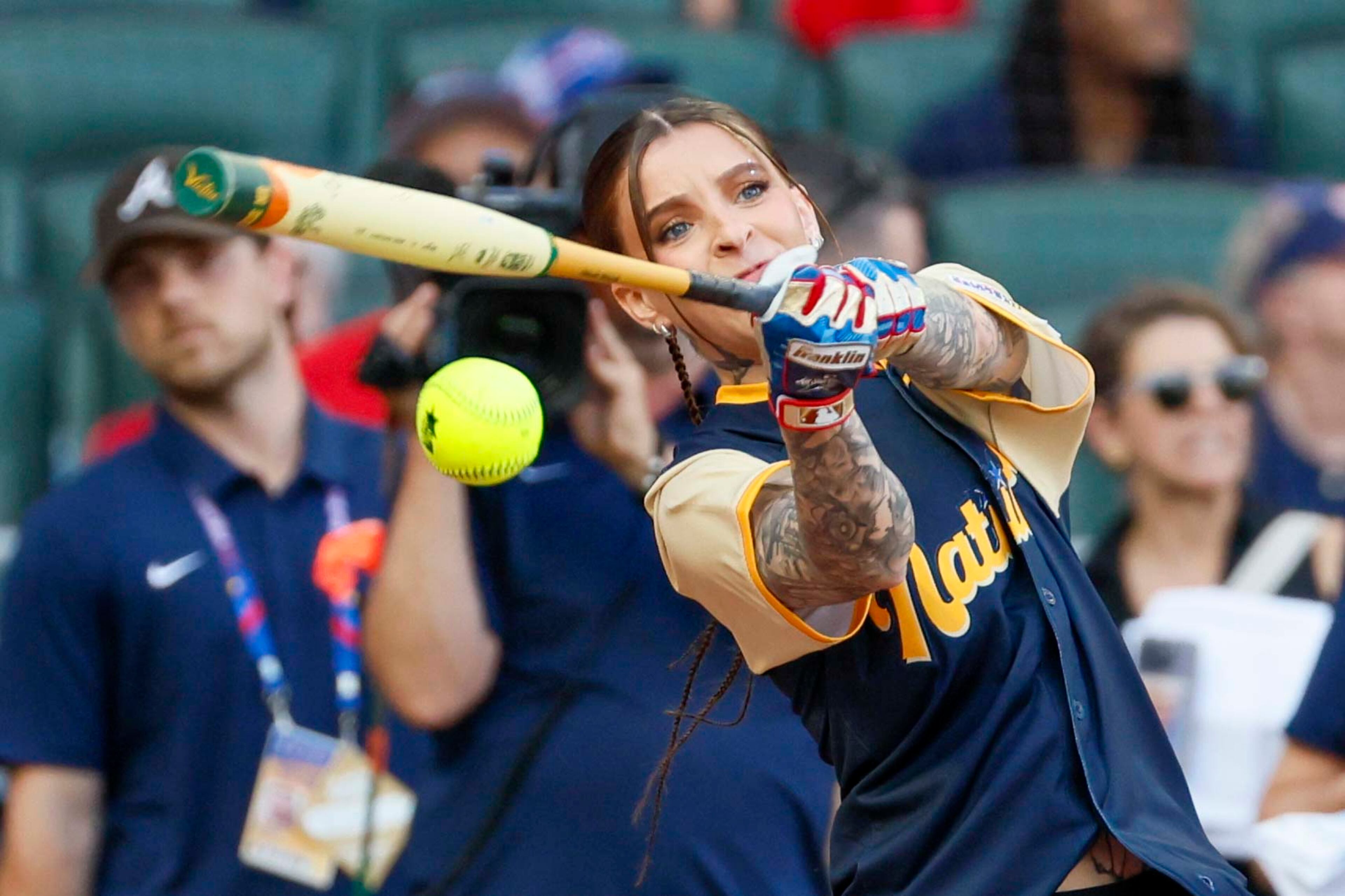 Young Miko, Puerto Rican Rapper & Singer, hits the ball during the MLB All-Star Celebrity Game at Truist Park on Saturday, July 12, 2025, in Atlanta.
(Miguel Martinez/ AJC)