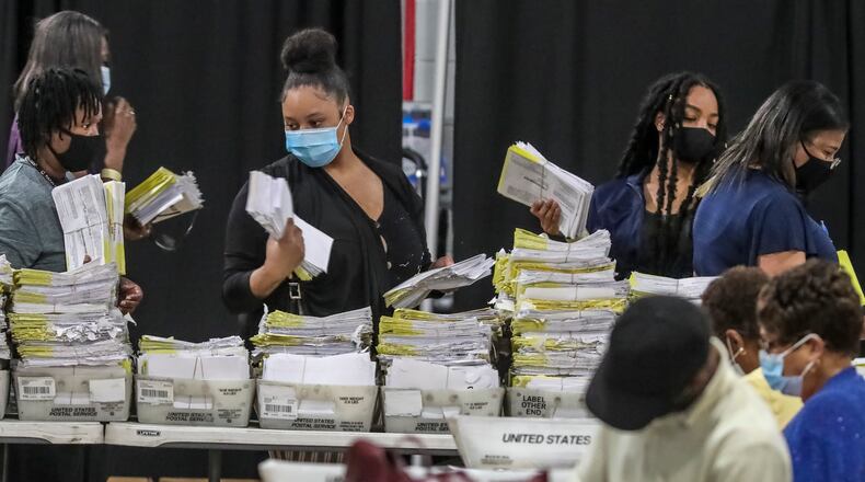 August 11, 2020 Atlanta: Some 70 Fulton County Registration & Election Board workers handled some 20,000 absentee ballots on Tuesday, August 11, 2020 at State Farm Arena located at 1 State Farm Drive in Atlanta. A heated race for Fulton County district attorney saw a light turnout at the polls on Tuesday, August 11, 2020. Incumbent Paul Howard faces his former chief deputy, Fani Willis, in a closely watched contest to become the county’s top prosecutor. Election officials said they learned lessons from the June 9 primary to avoid the kind of extreme lines that some voters encountered last time. Poll workers have been retrained. Technicians were on hand at every voting location in Cobb, DeKalb, Fulton and Gwinnett counties. Voting machines were delivered well in advance of election day. Still, some voters experienced problems and long waits at the polls. Nearly 377,000 Georgians already voted in advance of election day, most of them casting absentee ballots. About 60% of early votes were absentee; the rest were cast in person during three weeks of early voting. With so many voters using absentee ballots, election results might be slow to come in Tuesday night. Absentee ballots will be counted if they’re received by county election officials before 7 p.m., but each ballot has to be fed through a scanner to be counted, a process that can take days. Election officials say it’s normal for absentee vote-counting to take some time. But that means close races might not be settled on election night. The winners of Tuesday’s runoffs will advance to the general election in November, when turnout is expected to break records and exceed 5 million voters. JOHN SPINK/JSPINK@AJC.COM