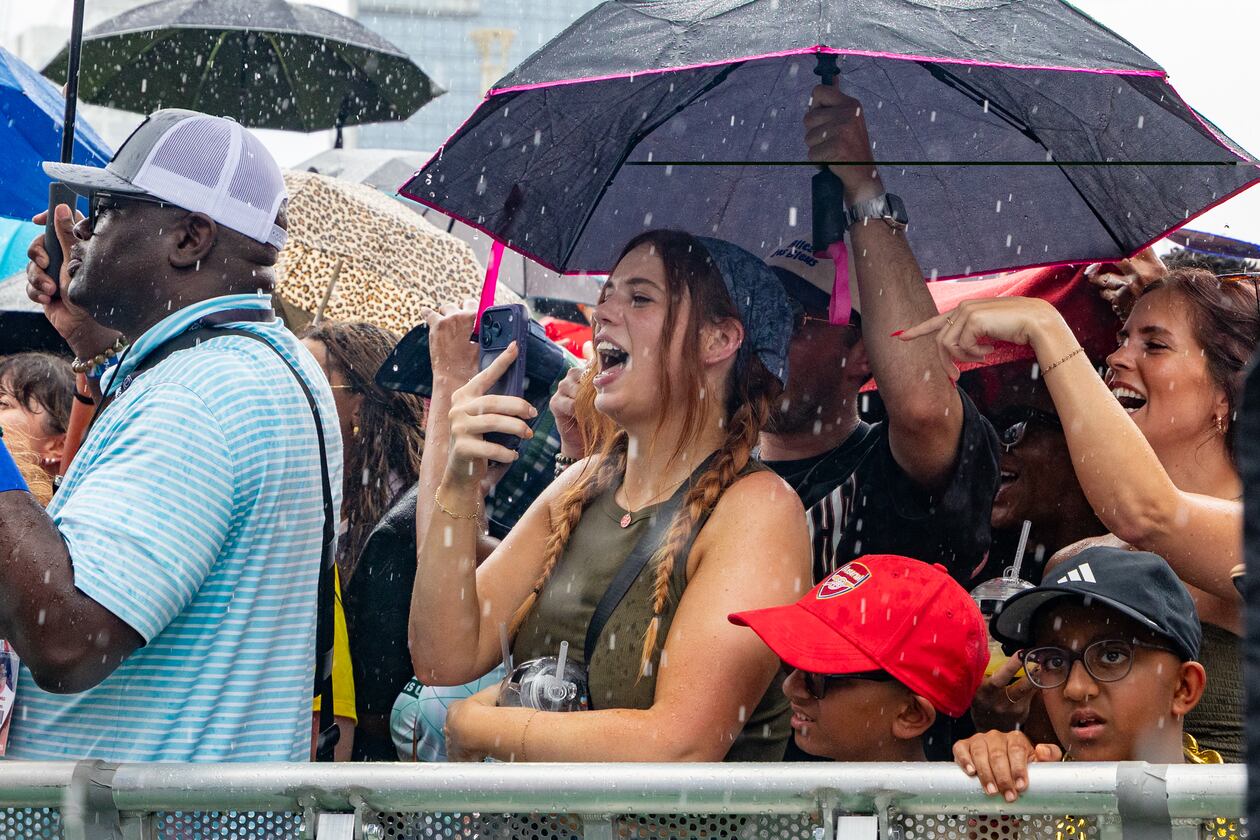 FIFA Fan Fest attendees gather for a Ludacris performance before the semifinal soccer game between France and Spain on Tuesday, July 14, 2026, in Centennial Olympic Park. Sunday's celebration at Piedmont Park may also see some rain and thunderstorms. (Jenni Girtman for The Atlanta Journal-Constitution)