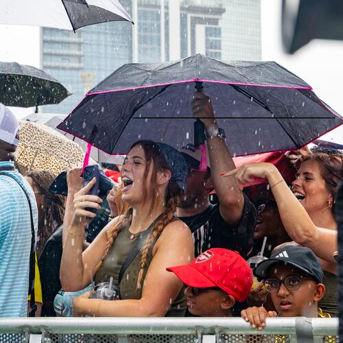 FIFA Fan Fest attendees gather for a Ludacris performance before the semifinal soccer game between France and Spain on Tuesday, July 14, 2026, in Centennial Olympic Park. Sunday's celebration at Piedmont Park may also see some rain and thunderstorms. (Jenni Girtman for The Atlanta Journal-Constitution)