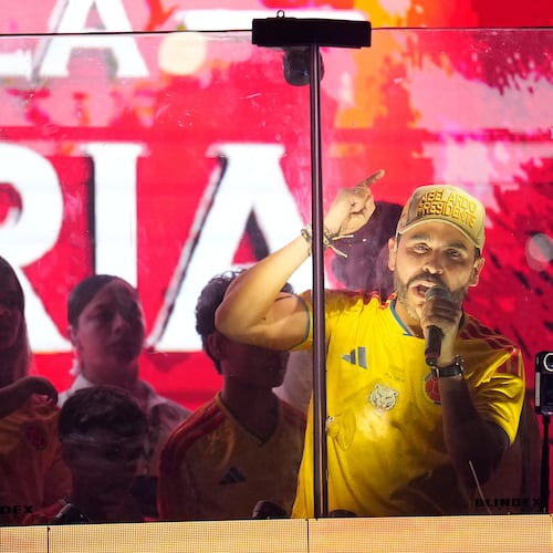 Presidential candidate Abelardo de la Espriella of the Defenders of the Motherland movement addresses supporters from inside a bulletproof booth after leading the first round of the presidential election and advancing to a runoff in Barranquilla, Colombia, Sunday, May 31, 2026. (AP Photo/Fernando Vergara)