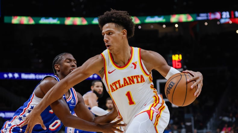Atlanta Hawks forward Jalen Johnson (1) dribbles against Philadelphia 76ers guard Tyrese Maxey (0) during the first half against the Philadelphia 76rs at State Farm Arena during an NBA exhibition game on Monday, October 14, 2024, in Atlanta. (Miguel Martinez/ AJC)