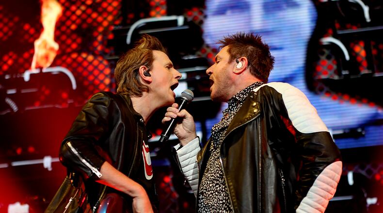 Still sharing a mic after all these years. (Akili-Casundria Ramsess/Special to the AJC)