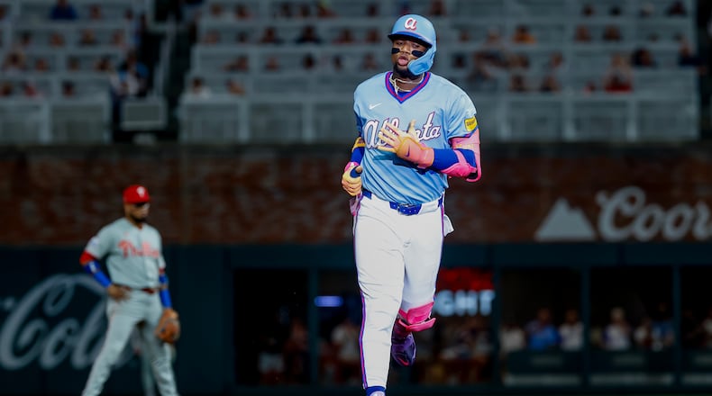 Atlanta Braves' Ronald Acuña Jr. rounds the bases after hitting a solo home run against the Philadelphia Phillies during the fourth inning of a baseball game, Saturday, Sept. 12, 2026, in Atlanta. (AP Photo/Erik S. Lesser)